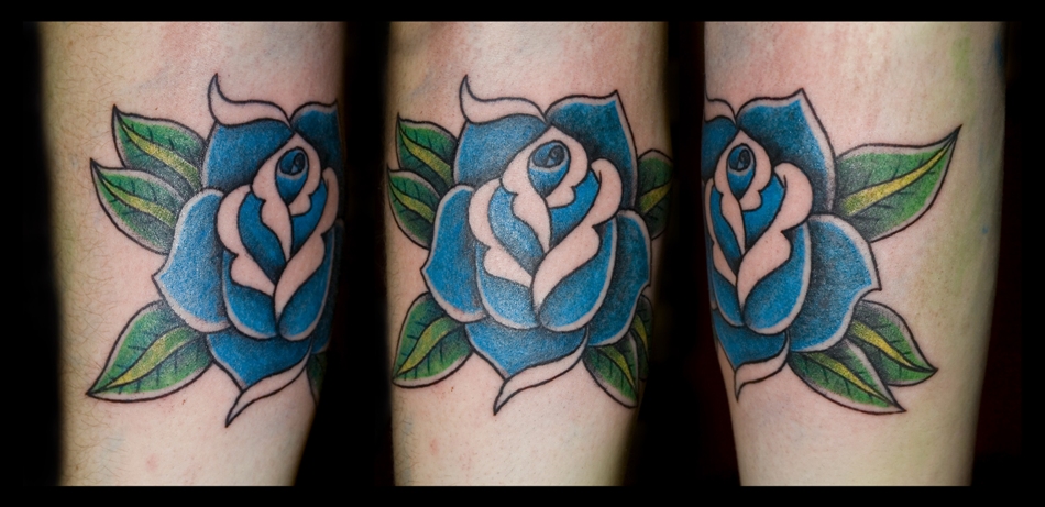 rose tattoo on elbow. Traditional style rose