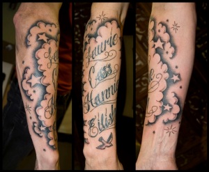 Tattoo script with stars and clouds