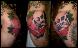skull skeleton rose elbow tattoo